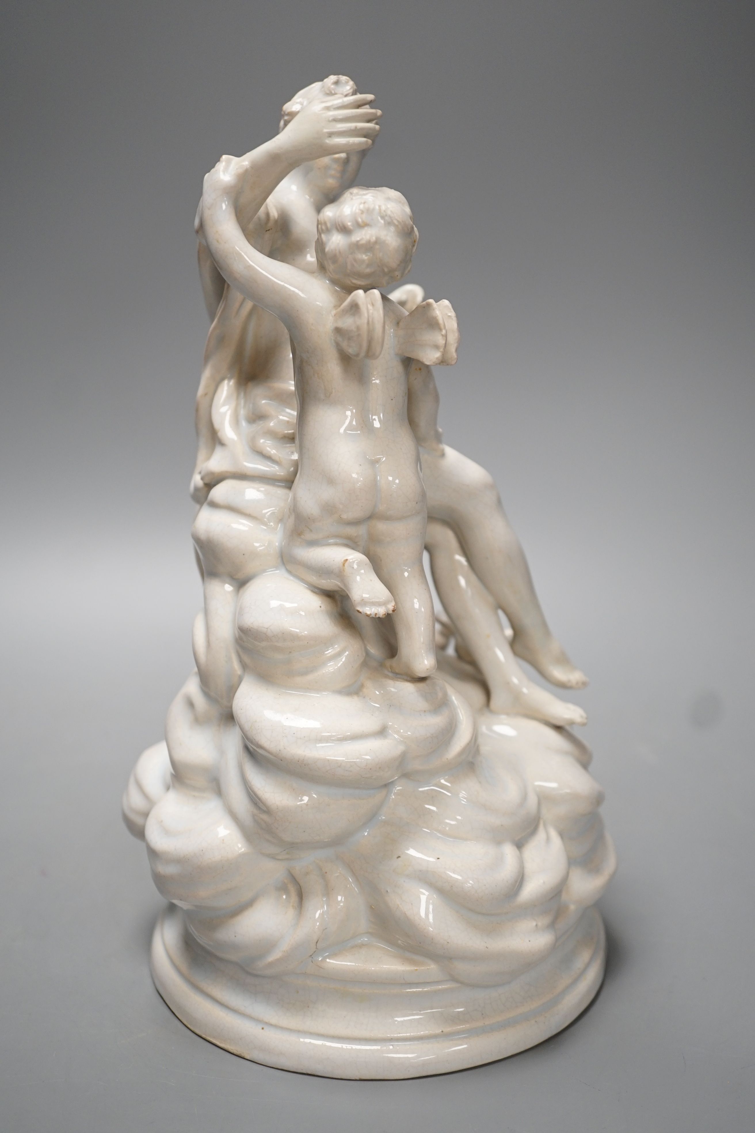 A 19th century Naples style maiolica group of Venus and Cupid - 26.5cm high